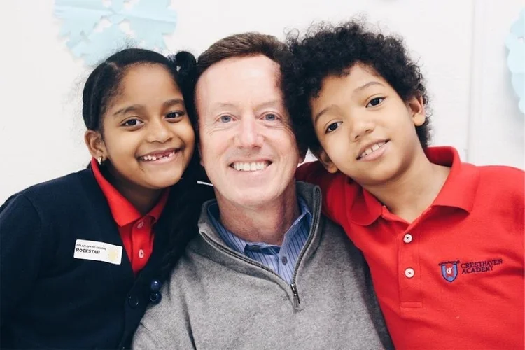 Steve Colson, Founder, with Champions Academy students